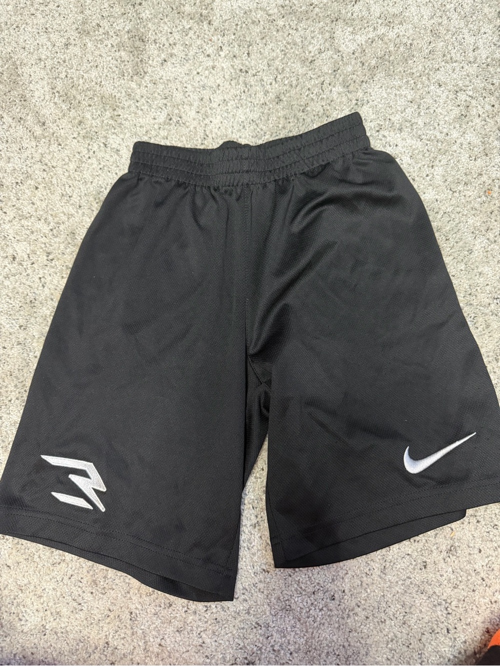 Nike Black Athletic Shorts with White Swoosh and Graphic